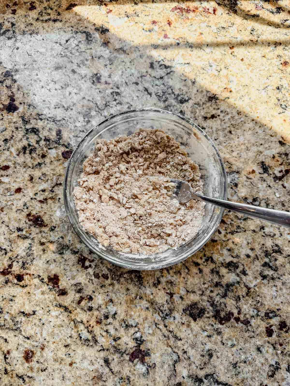 crumb topping mixed in a small glass bowl.