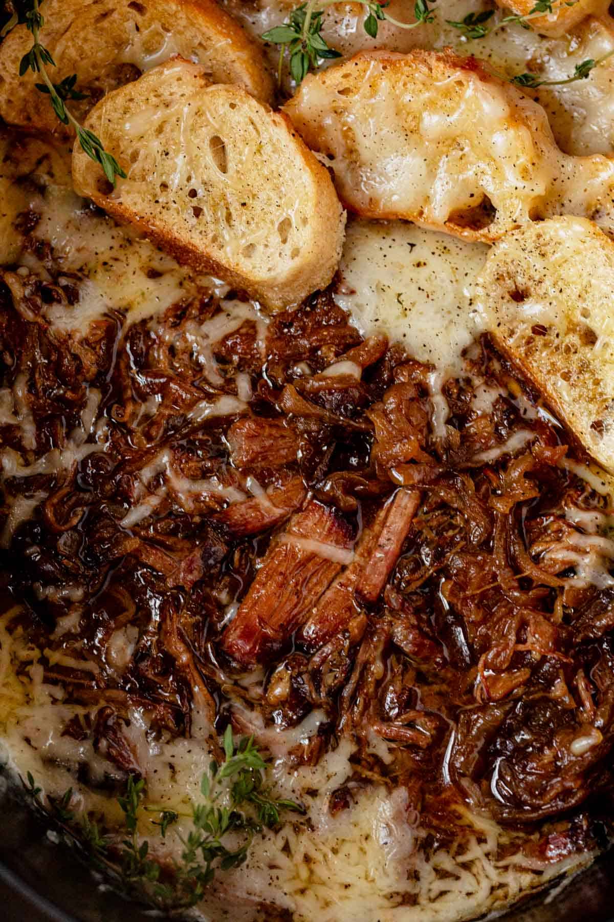 shredded french onion pot roast topped with crusty bread and melted gruyere cheese.