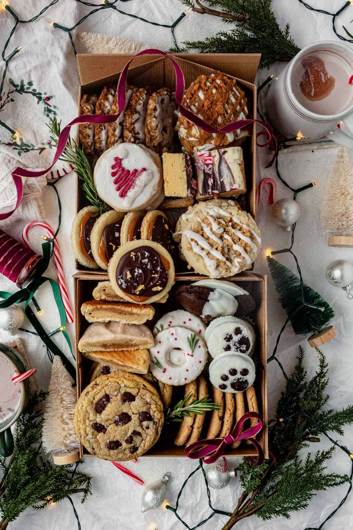 holiday cookie box filled with homemade cookies of different shapes and varieties.