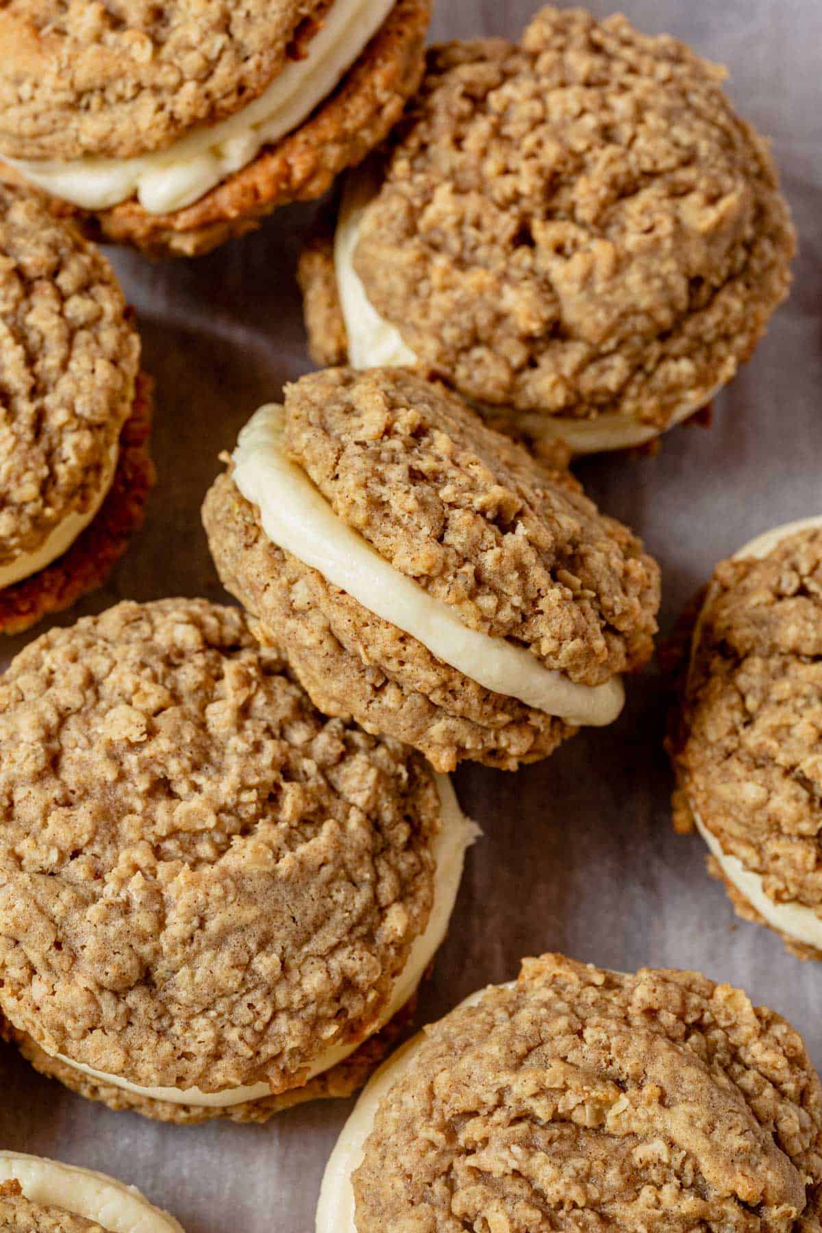 a batch of chai spiced oatmeal cream pies on a piece of parchment paper.