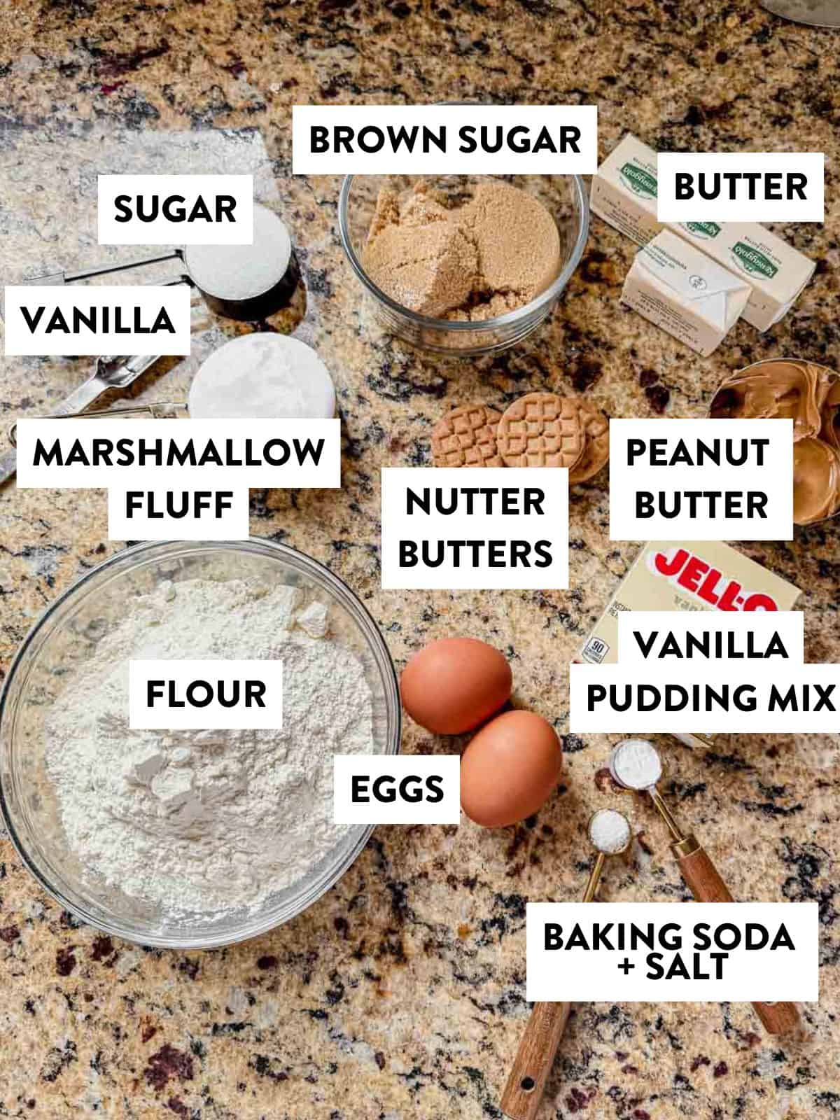 ingredients for fluffernutter cookies laid out on a granite countertop.