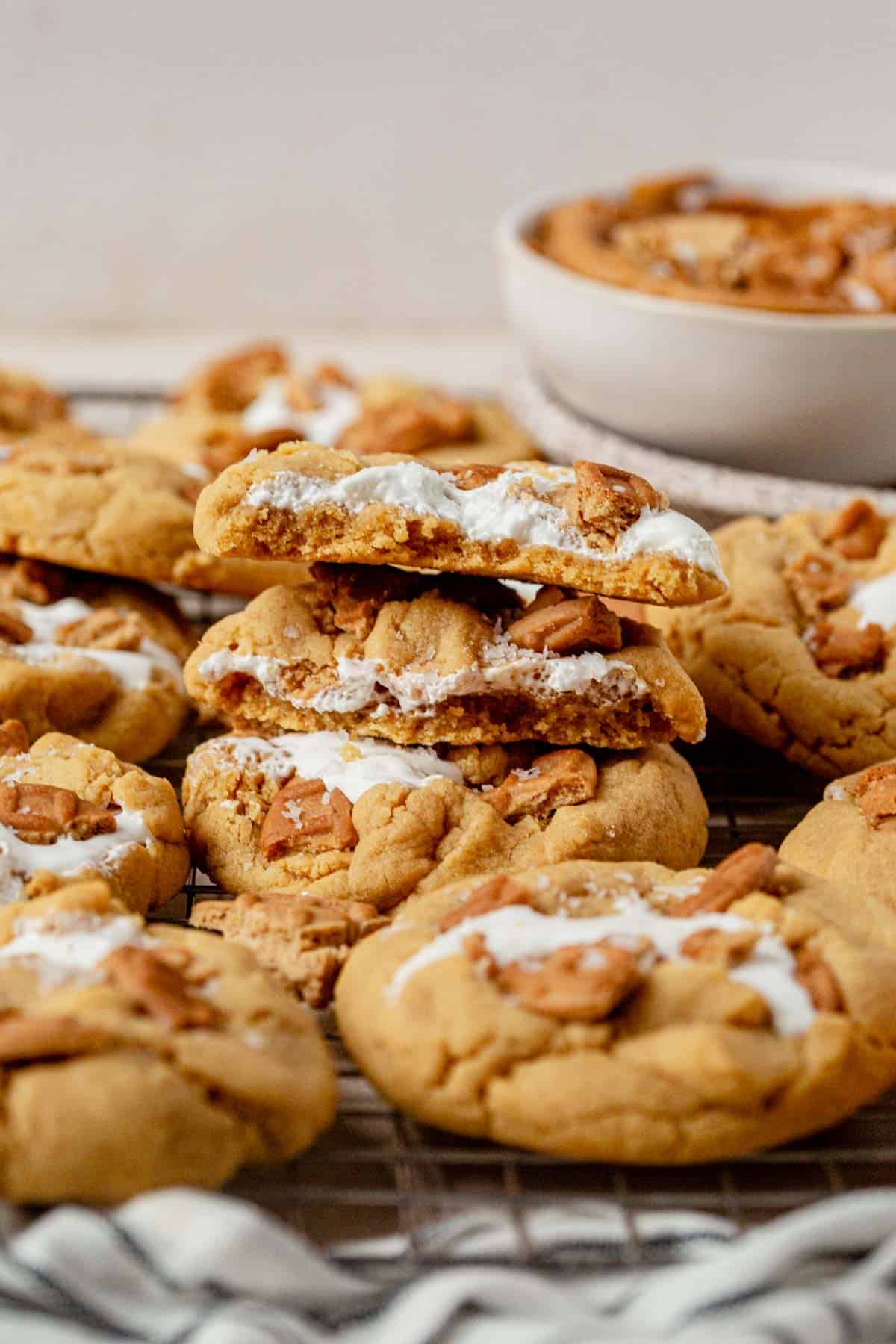 fluffernutter cookies piled up on a cooling rack.