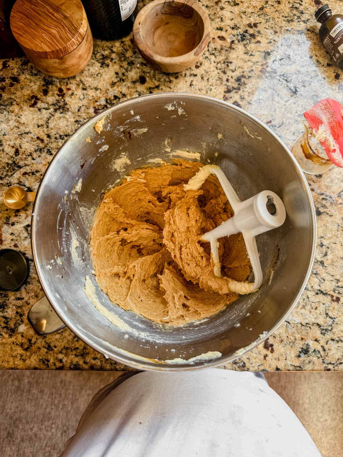 gingerbread latte cookie dough in a stand mixer with the paddle attachment.