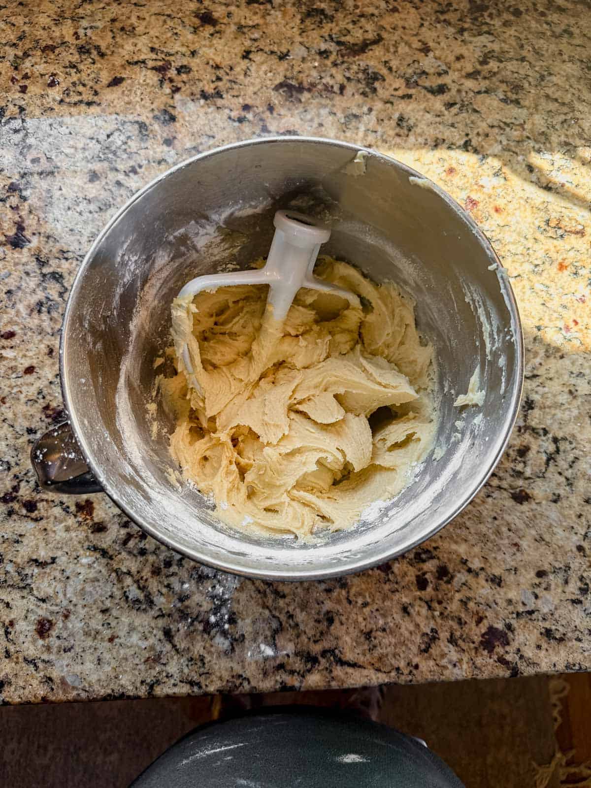 wet ingredients for sugar cookie dough in a stand mixer with the paddle attachment.