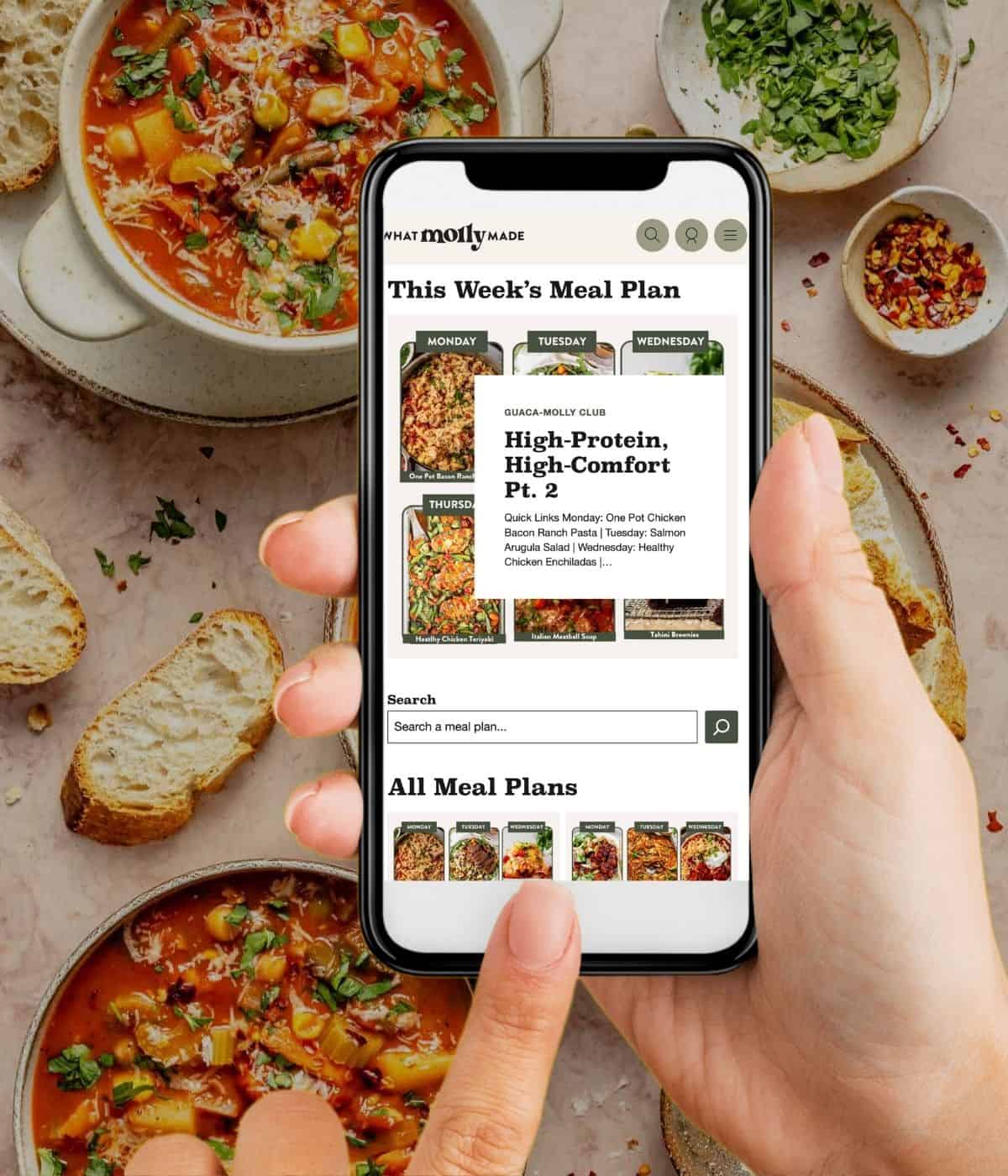 holding a phone logged into the guaca molly club.