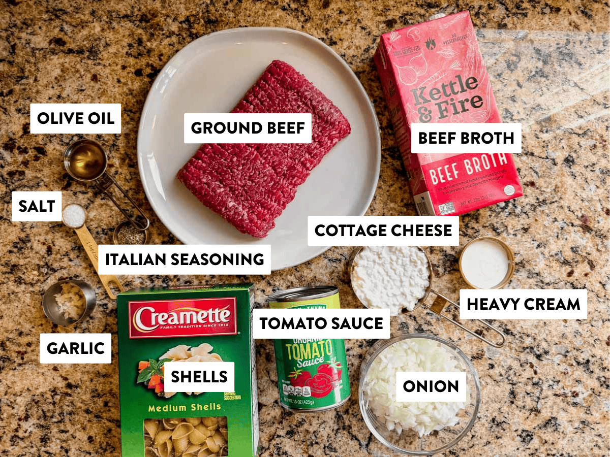 ingredients for creamy ground beef and shells on a counter.