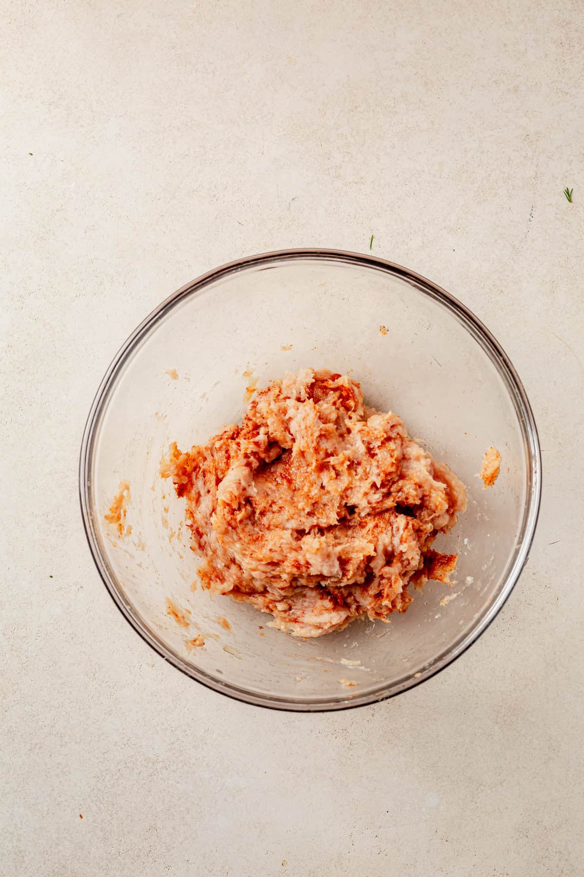 seasoned ground chicken in a mixing bowl.