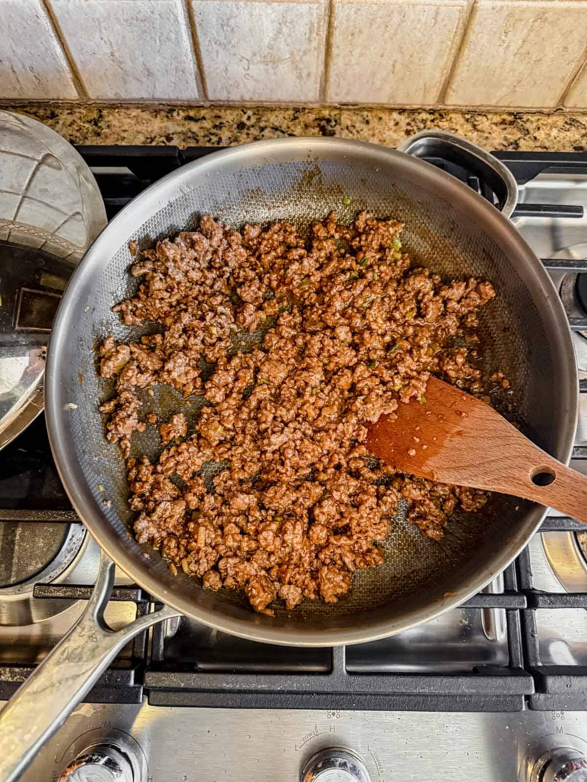 saucy korean ground beef cooked in a skillet to coat the beef in the thickened sauce.