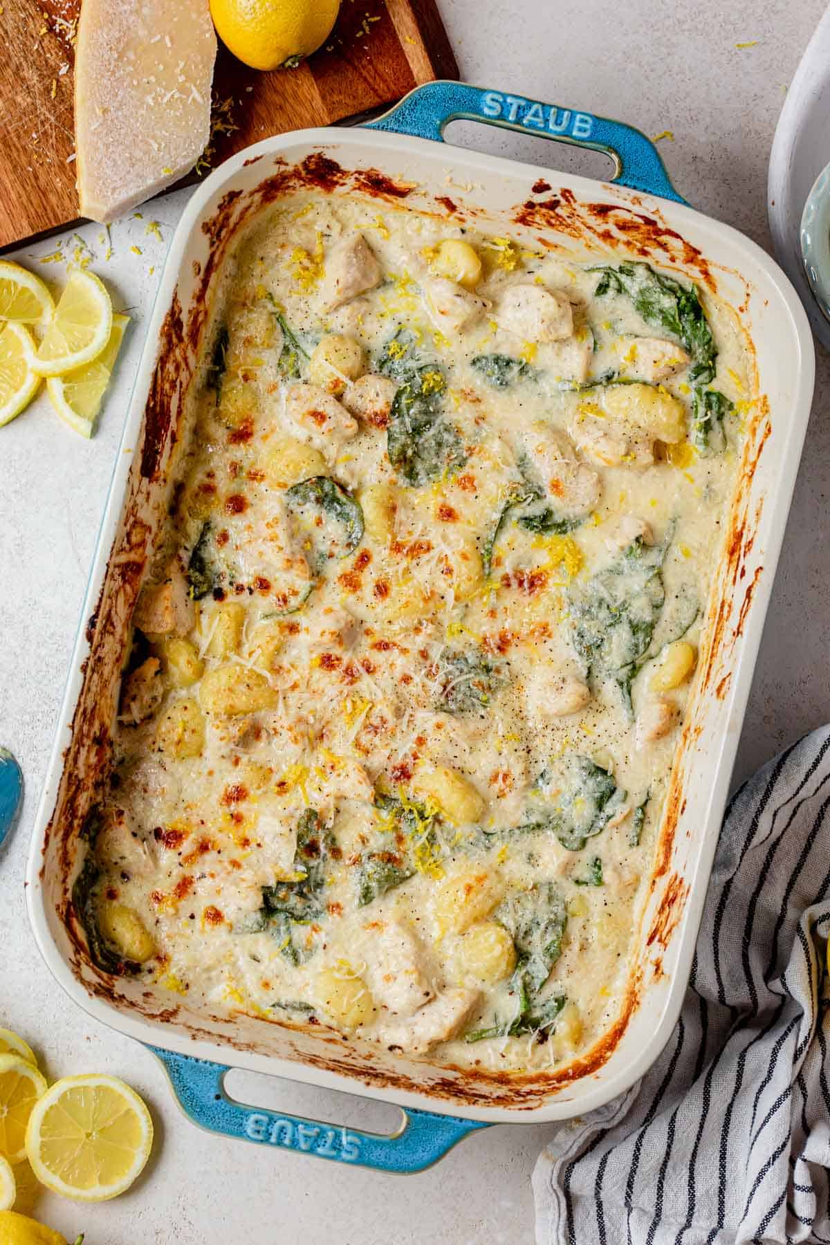 creamy lemon chicken gnocchi in a casserole dish on the counter.