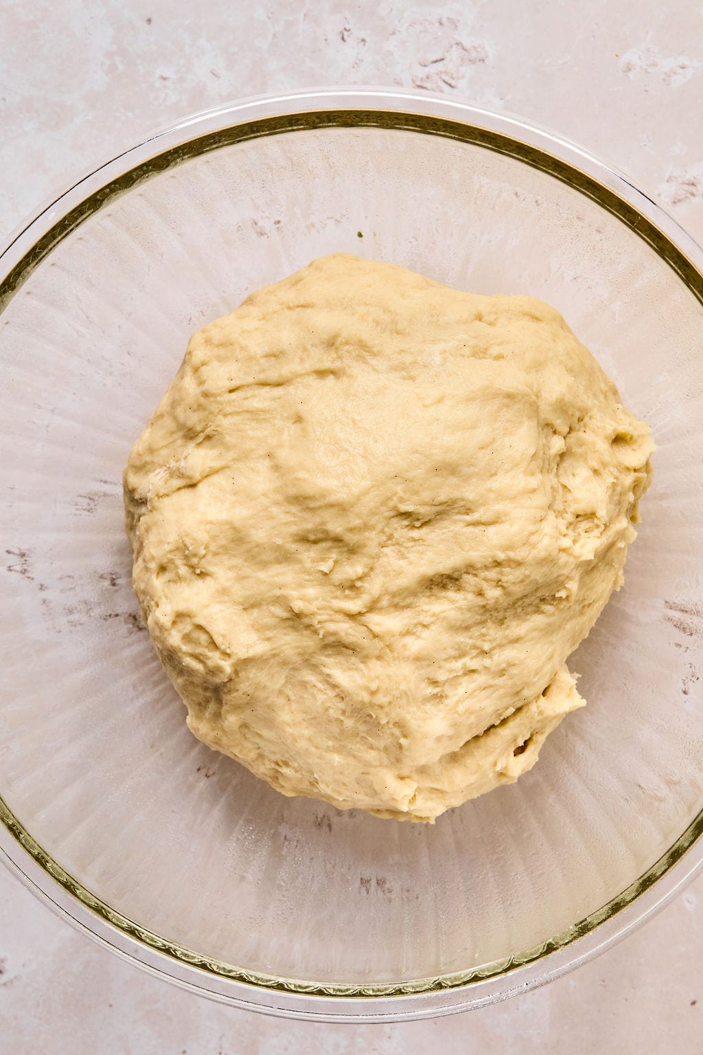 cinnamon roll dough in a bowl before rising.