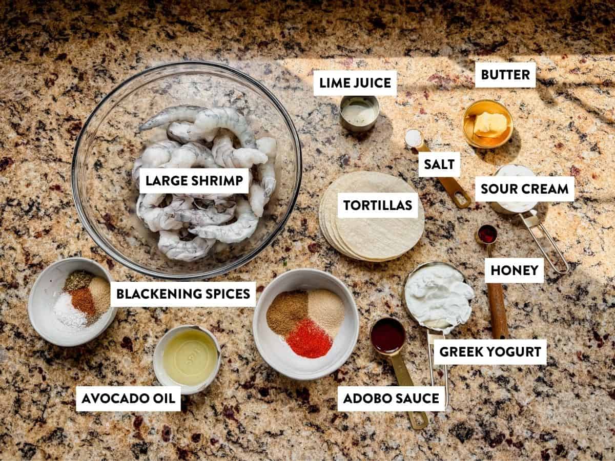 ingredients for blackened shrimp tacos on a counter.