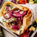 chicken doner kebab layered in a pita with tzatziki and pickled onion.