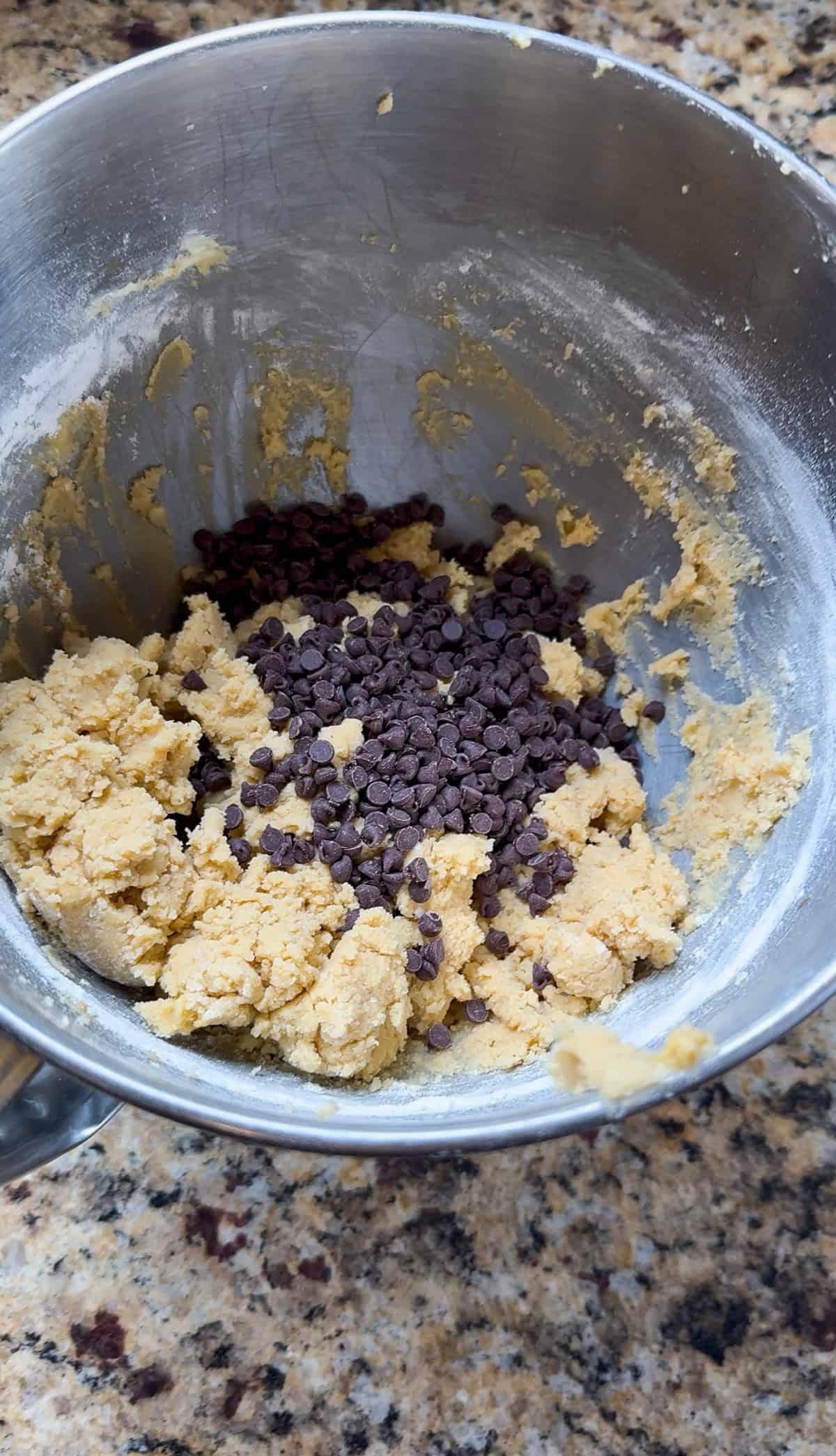 mini chocolate chip cookie dough in the bowl of a stand mixer.