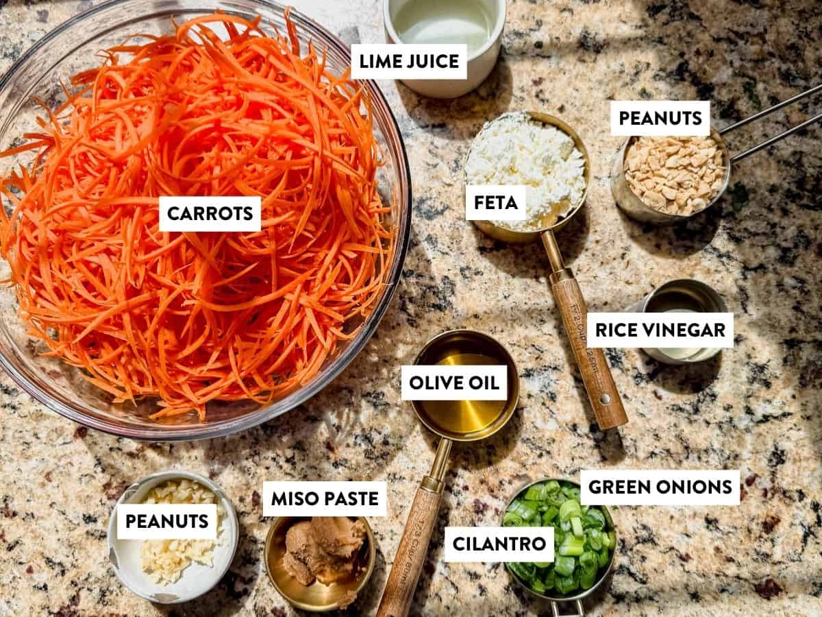 carrot ginger salad ingredients on a countertop with labels.