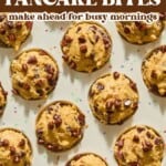 A tray filled with round chocolate chip pancake bites, topped with chocolate chips. Text above reads: chocolate chip PANCAKE BITES make ahead for busy mornings..